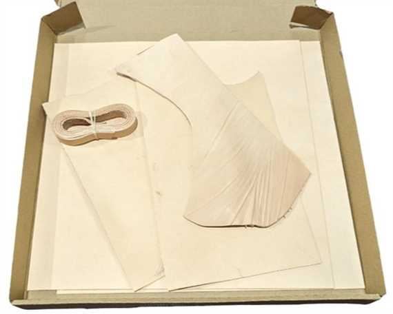  VEG TANNED LEATHER 2mm IN A BOX, TWO 36 X 36cm PIECES, ONE STRAP AND SOME OFF CUTS